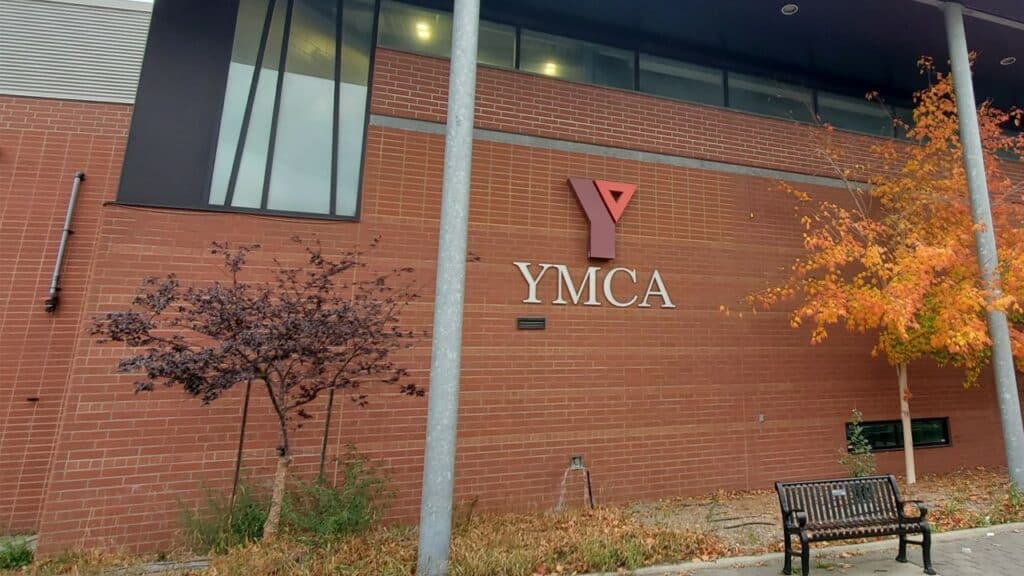 Exterior of the Centre for Life with the YMCA logo.